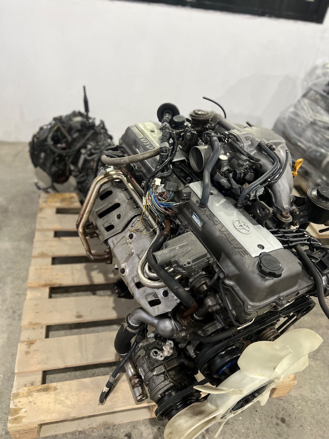 JDM 1FZ-FE engine with matching transmission on pallet at Land Cruiser Heaven