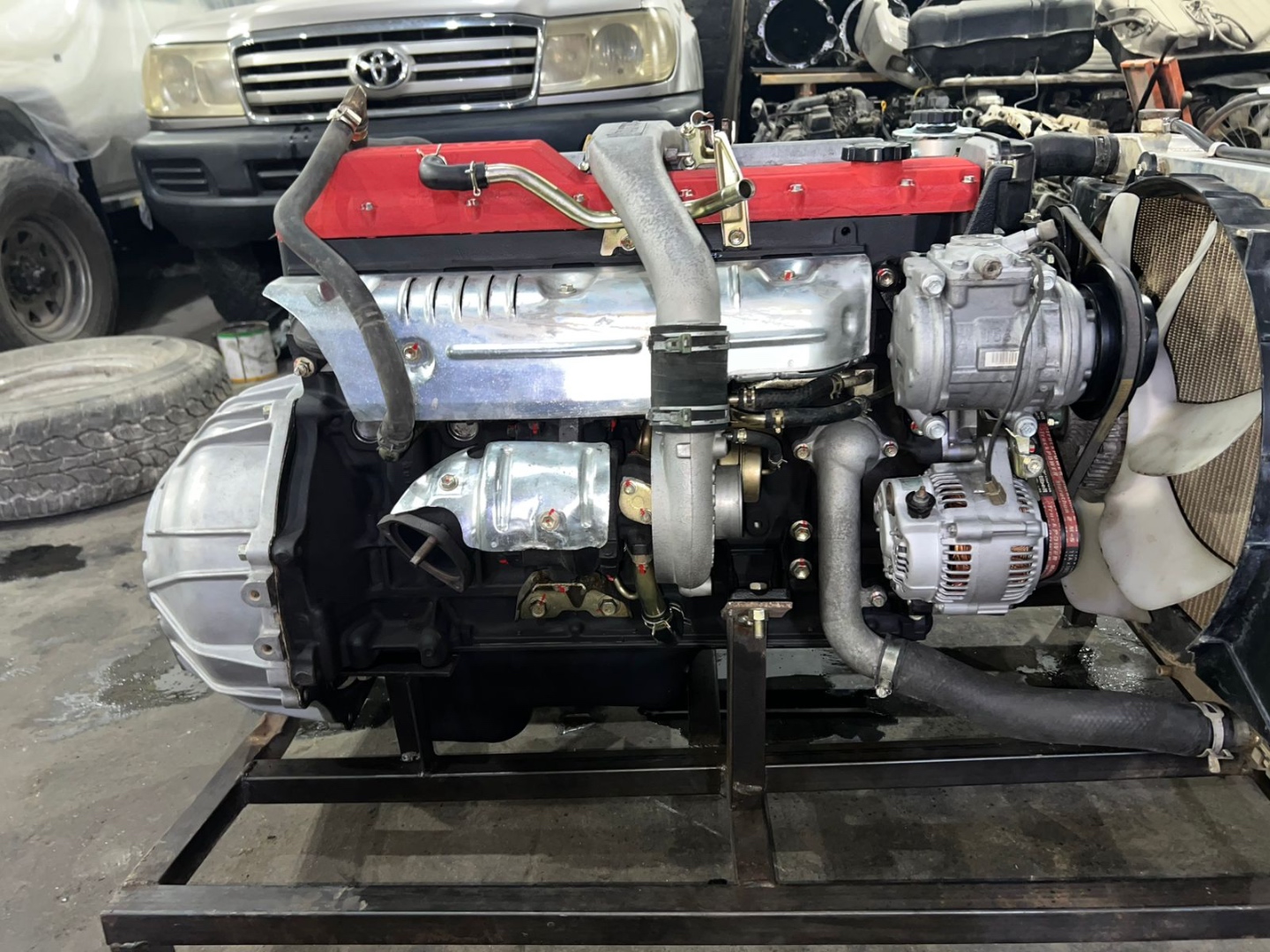 1HD-T engine with transmission on stand during diesel conversion at Land Cruiser Heaven